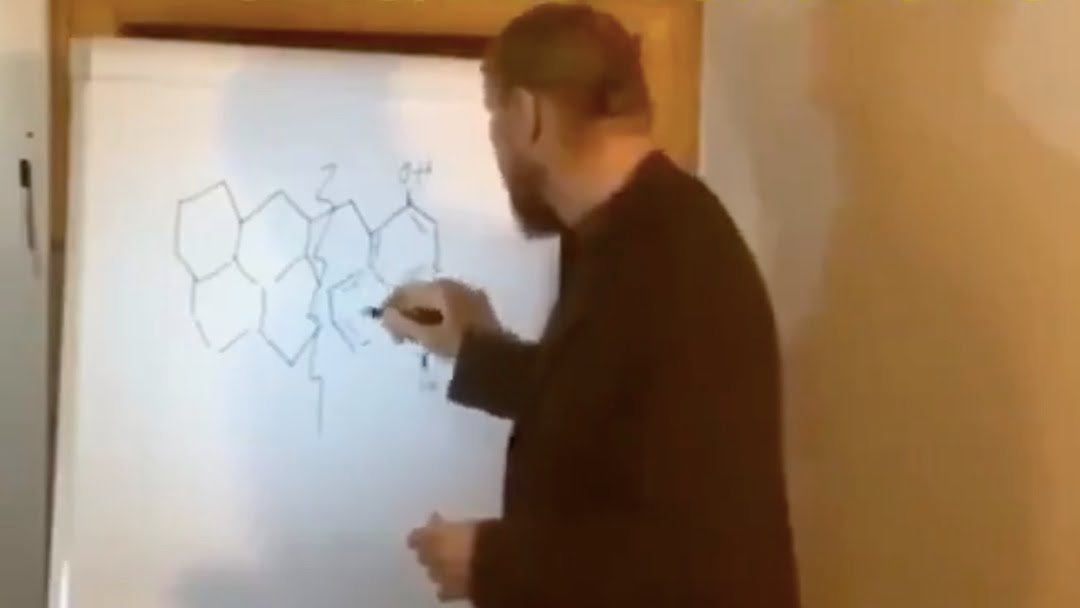 1. Dr. Noack draws the graphene hydroxide structure on the whiteboard.