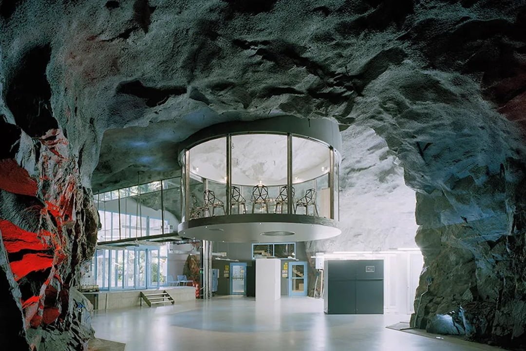 Former nuclear bunker built in 2008 under the granite bedrock of Stockholm is now an impenetrable data center complex with waterfalls & greenhouses [Courtesy of Albert France-Lanord Architects].