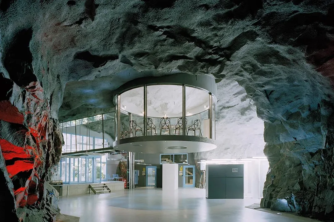 Former nuclear bunker built in 2008 under the granite bedrock of Stockholm is now an impenetrable data center complex with waterfalls & greenhouses [Courtesy of Albert France-Lanord Architects].